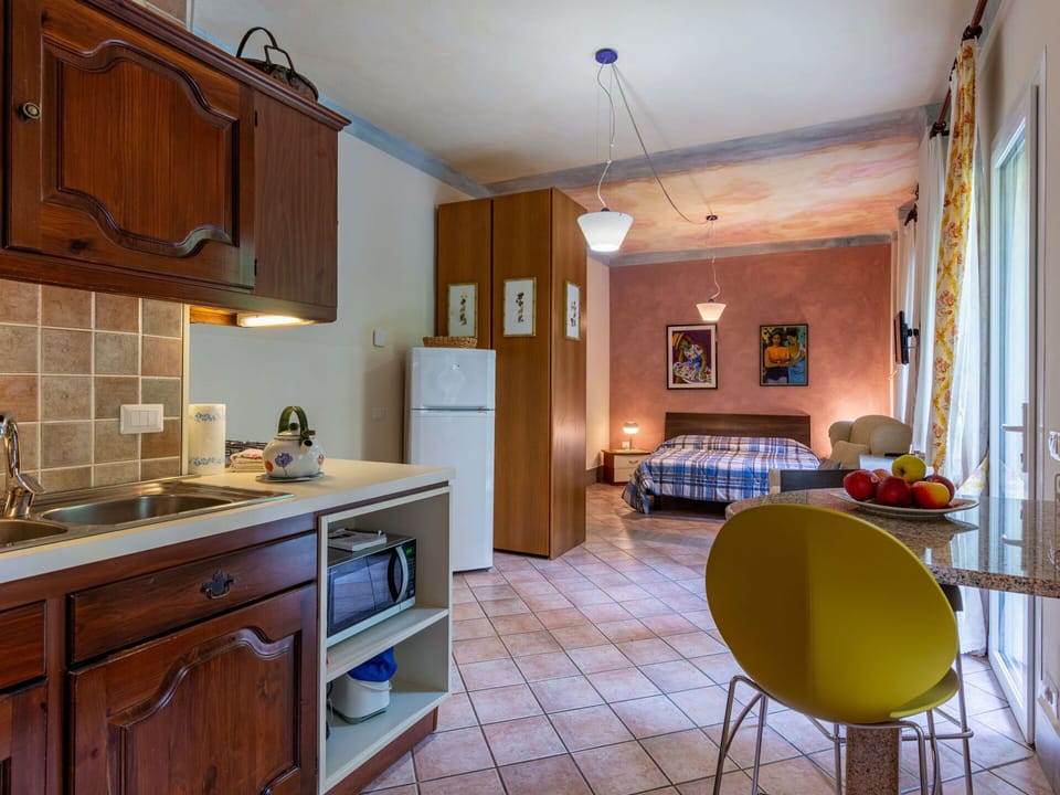 Cabinetry, Furniture, Countertop, Property, Kitchen Appliance, Kitchen, Home Appliance, Wood, Interior Design, Lighting