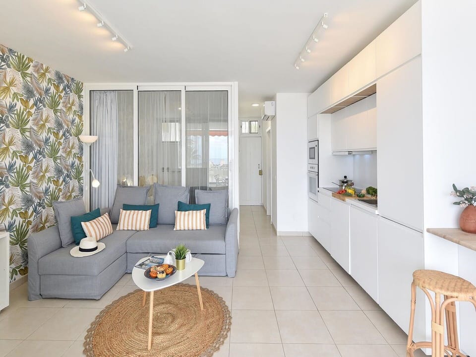 Furniture, Couch, Table, Interior Design, Houseplant, Picture Frame, Orange, Floor, Flooring