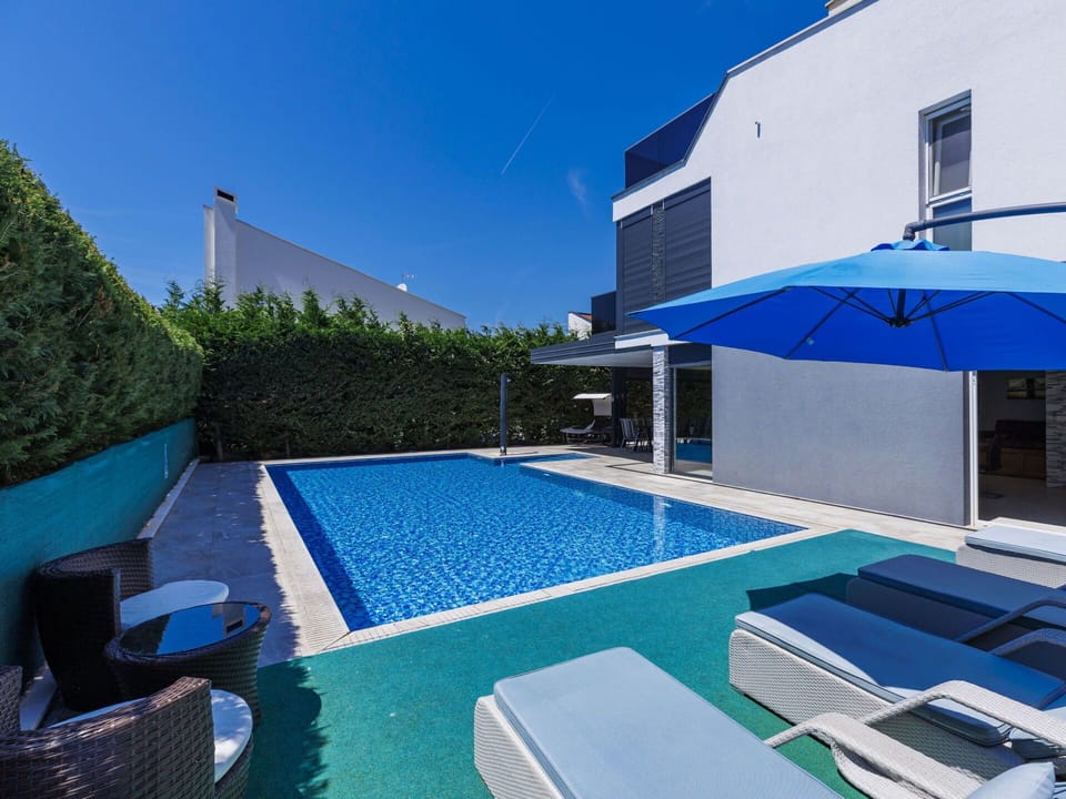 Property, Sky, Building, Blue, Swimming Pool, Azure, Plant, Outdoor Furniture, Shade, Window
