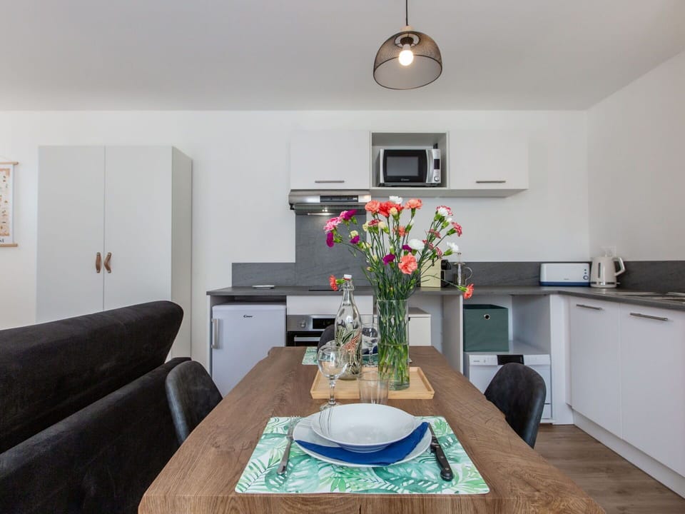 Flower, Table, Furniture, Property, Plant, Picture Frame, Couch, Cabinetry, Building, Lighting