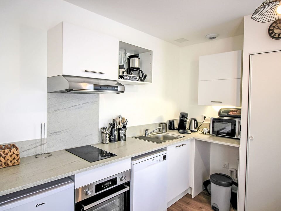 Property, Cabinetry, Countertop, White, Kitchen, Kitchen Stove, Kitchen Appliance, Sink, Lighting, Cooktop
