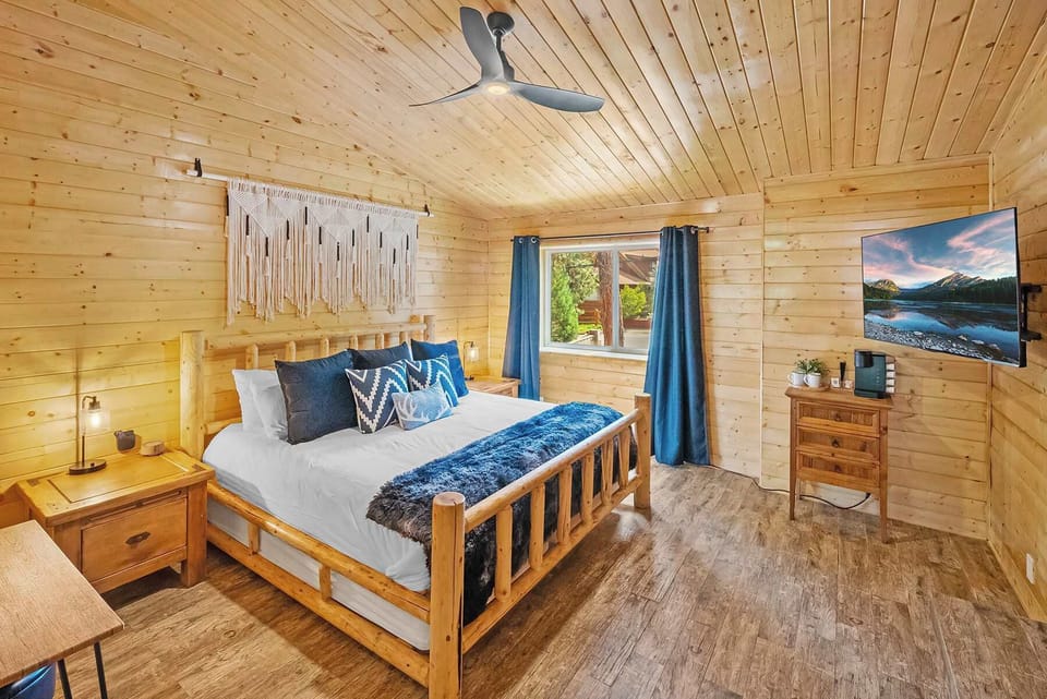 Upstairs 3rd bedroom featuring gas burning fireplace, LCD TV and private ensuite full luxury bathroom with separate tub. 