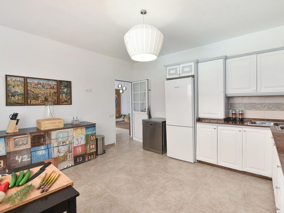 Cabinetry, Furniture, Countertop, Interior Design, Wood, Window, Picture Frame, Houseplant, Home Appliance, Kitchen