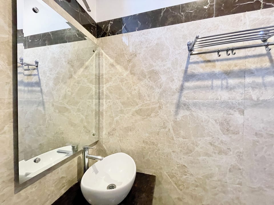 Shower, rainfall showerhead, towels, soap