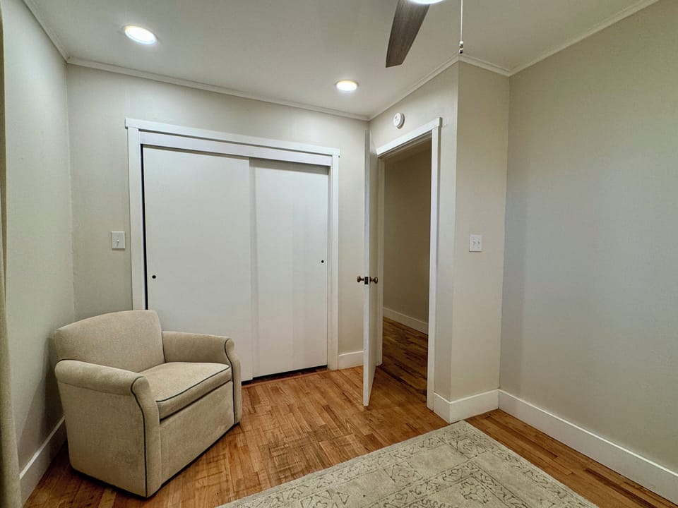 Swivel chair for lounging in the twin bedroom.