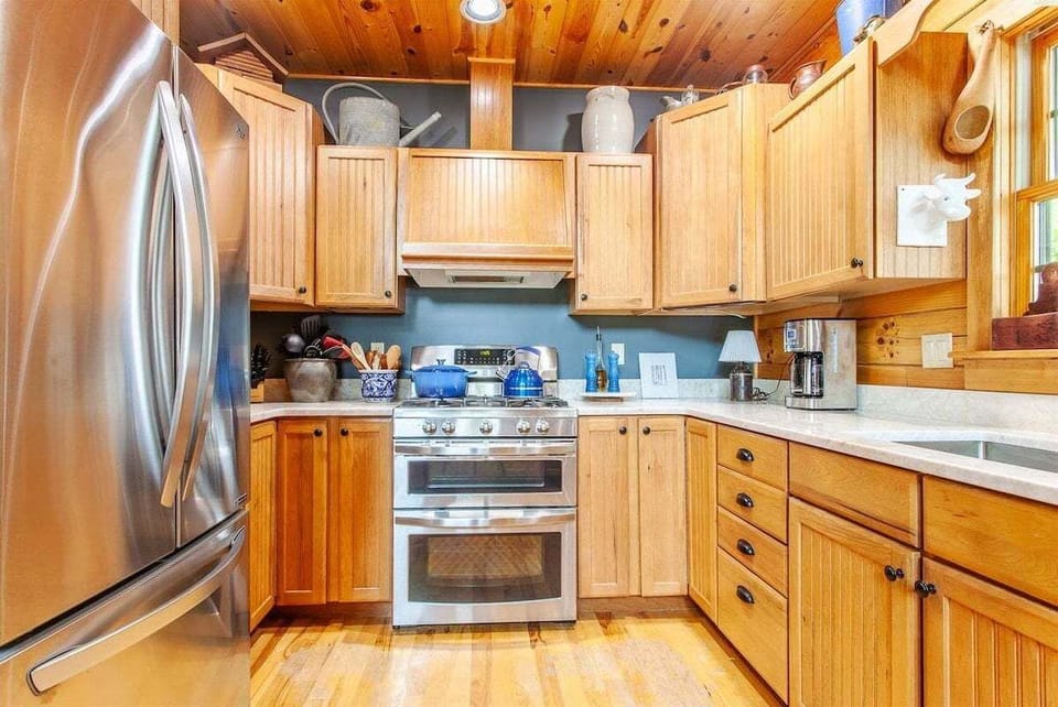 Truly a cooks kitchen at Hazy View Cabin with rustic cabinetry, modern appliances, and cozy cabin charm.