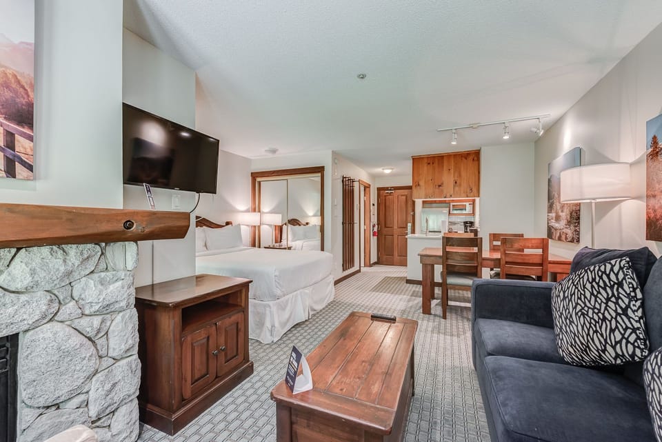 Spacious living area with a fireplace, perfect for relaxing or gathering.