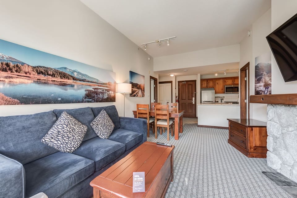 Cozy living area with plenty of seating and a TV for relaxing.