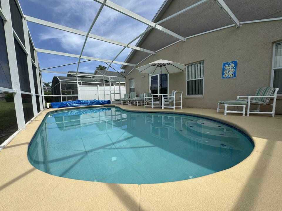 Outdoor pool, pool umbrellas, sun loungers