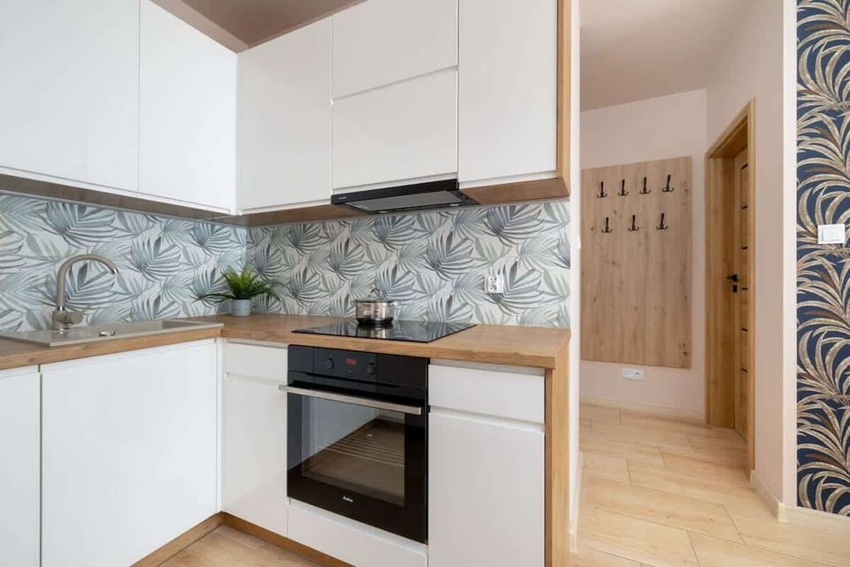 Cook and dine in style with the modern kitchenette and dining area.