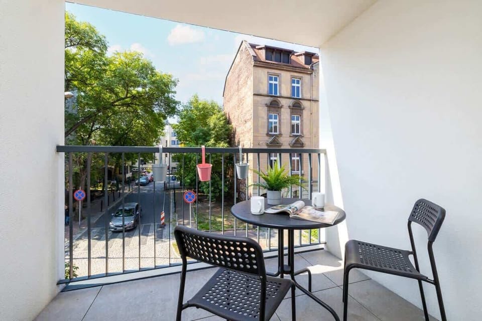 The balcony's cozy setup is perfect for relaxing evenings.