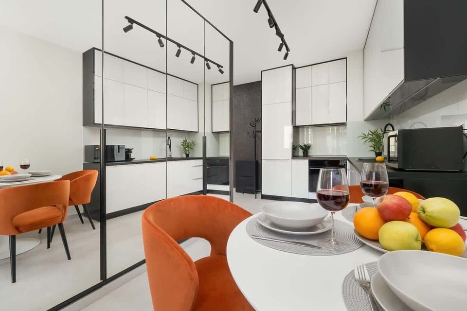 Living area with coffee table and kitchenette.