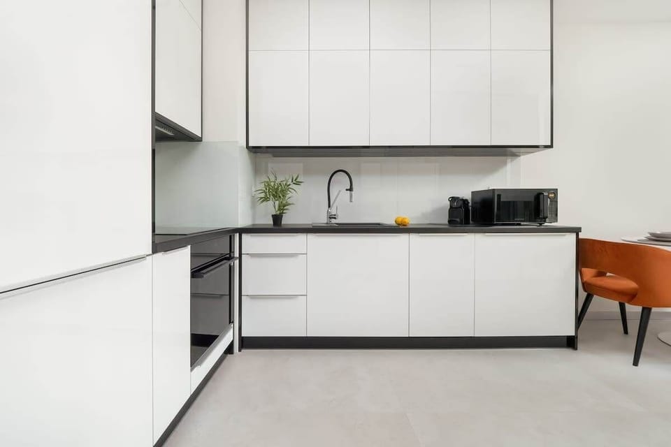 White kitchenette with an oven.