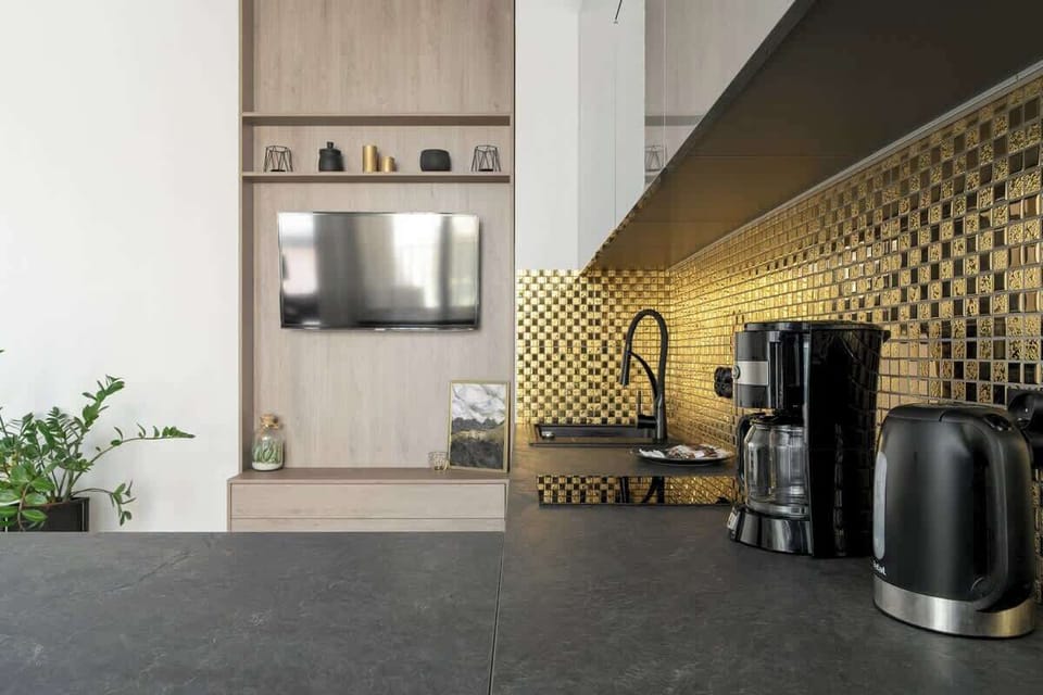 Modern and stylish kitchenette with kettle and coffee machine.
