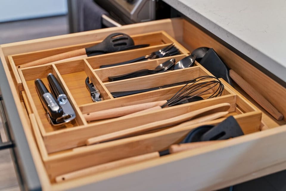 Fully stocked kitchen drawer, providing you with all the necessary utensils for cooking and dining.