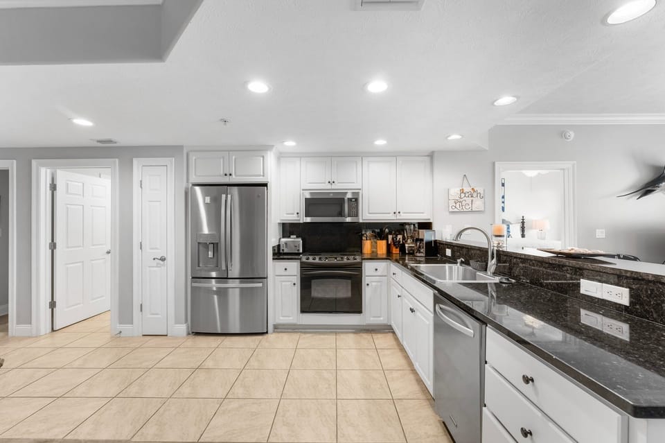 modern kitchen with stainless steel appliances and granite countertops