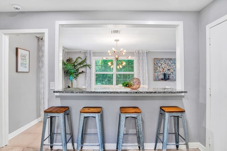 Cozy breakfast nook with a charming view overlooking the dining area, perfect for enjoying morning coffee or casual meals.