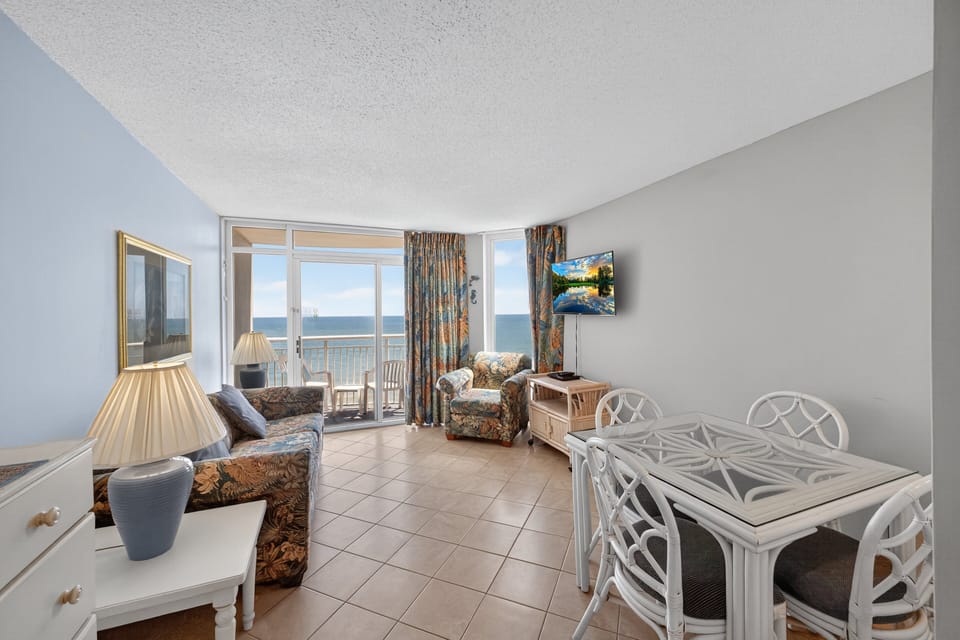 Dining Area - Gather around the dining area to enjoy meals and plan your beach adventures.