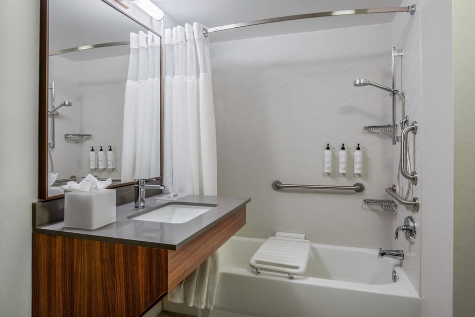 Designer toiletries, hair dryer, towels, soap