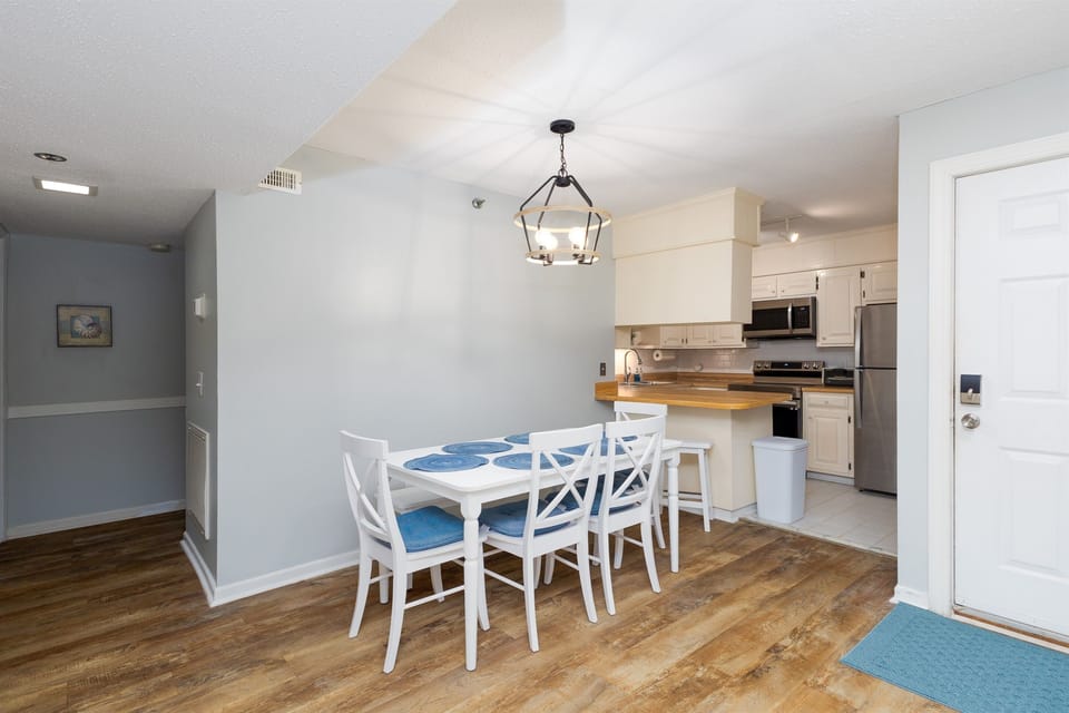 Elegant kitchen with dining table and cabinetry