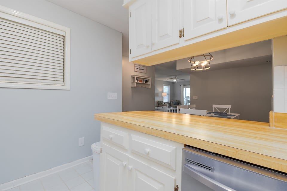 Views of living room and dining table from the kitchen
