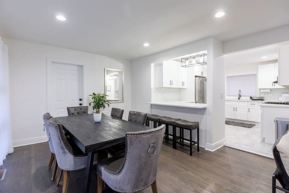 Dining Room leads into the full kitchen. Seating available for 10 between dining and bar stools. 