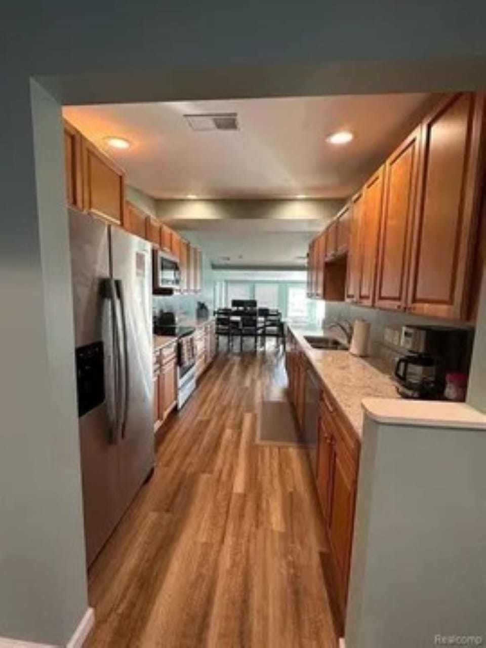 The Gourmet kitchen is stocked with  lots of small appliances and cookware.
