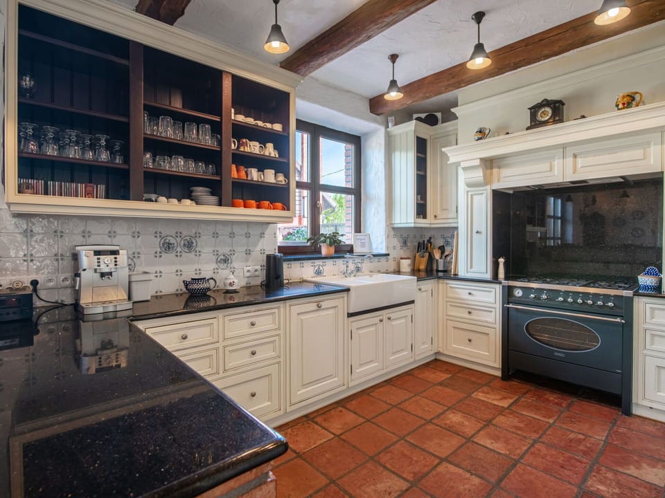 Kitchen, Countertop, Cabinetry, Interior Design, Flooring, Furniture, Kitchen Appliance, Wood, Kitchen Stove, Major Appliance