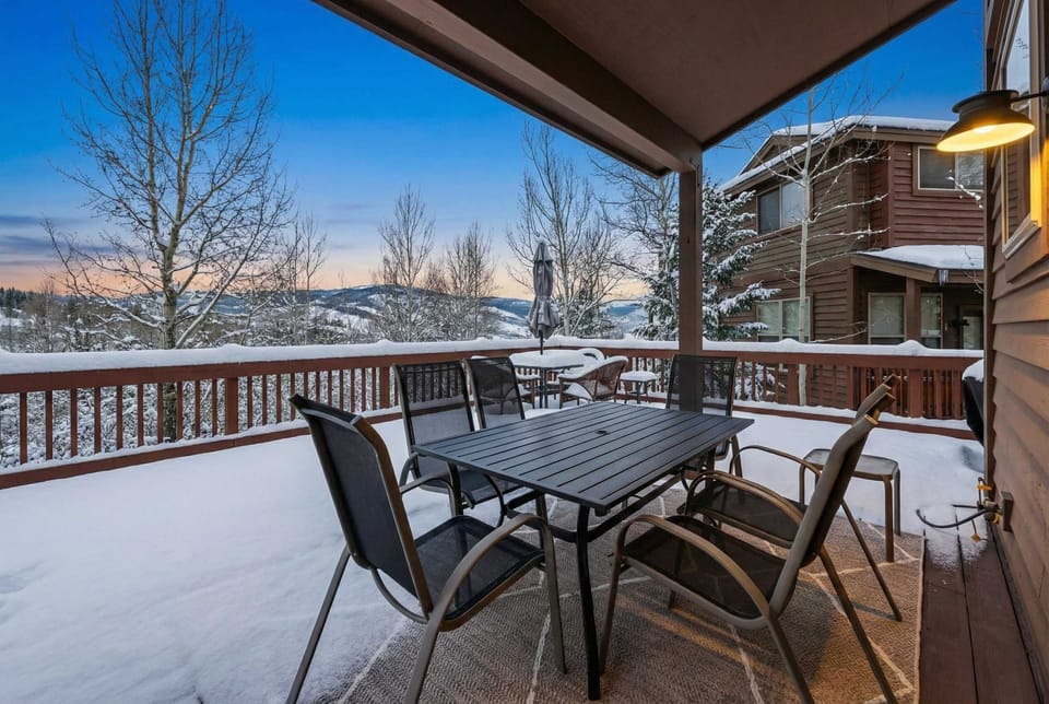 Exterior: Upper deck, outdoor dining, gas BBQ, serene forest views