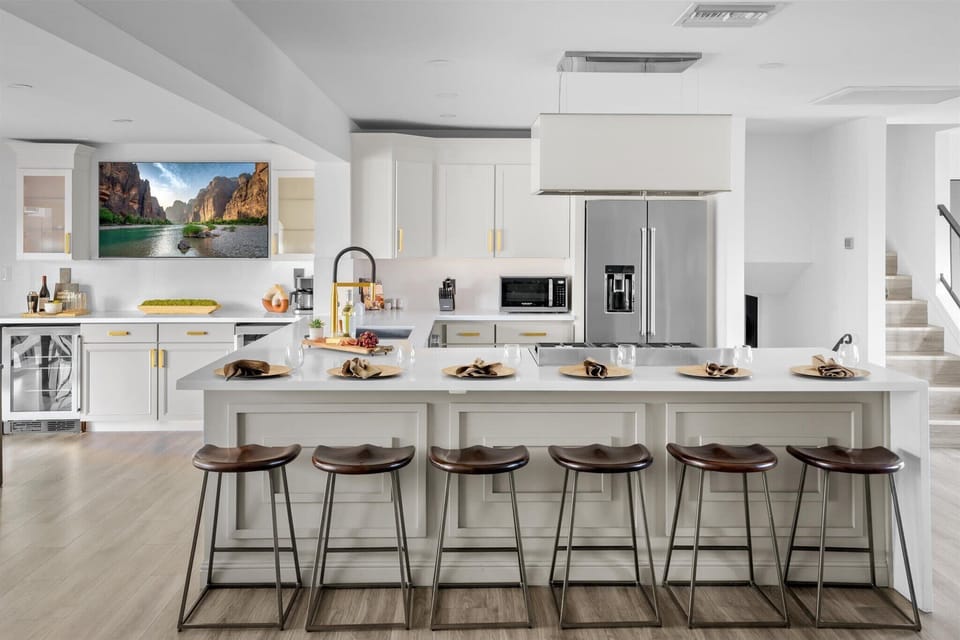 Whip up your favorite meals in our fully stocked kitchen, featuring expansive counter space and high seating for 6—perfect for gatherings.