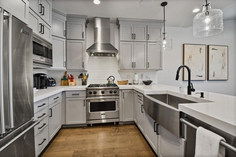 Open-concept modern kitchen, offering a great space to prepare meals while staying connected with the group.