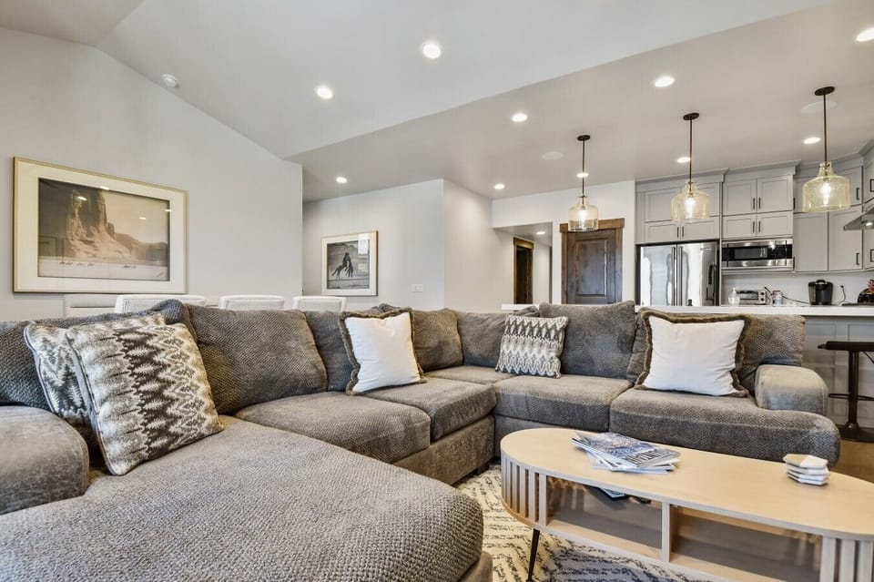 Inviting living room with a cozy sofa and a beautiful view of the mountains.