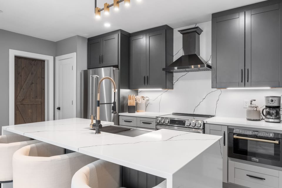 The large kitchen island with additional seating makes this a great space for meals and entertaining.