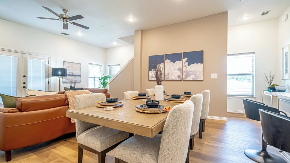 Gather around and eat like you live here. The dining area seats your whole group and flows seamlessly into the full kitchen — ideal for group travel, family stays, and anyone who wants more than a hotel room near Globe Life Field.