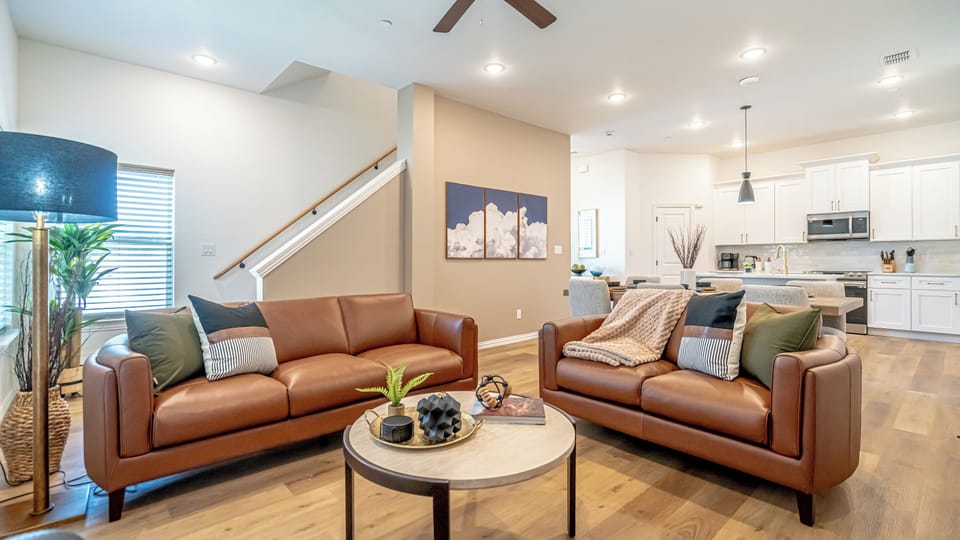 Kick back in a stylish, open-concept living space designed for comfort and connection. Whether you're debriefing after a Rangers game, watching pre-game coverage on the smart TV or just relaxing with your crew—The Ryan's living area has you covered.