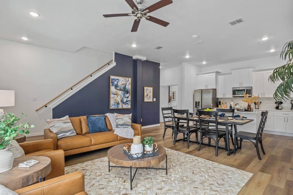 Unwind in a stylish living room with sleek furnishings and inviting seating, the perfect retreat after a day of excitement in Arlington's entertainment district.