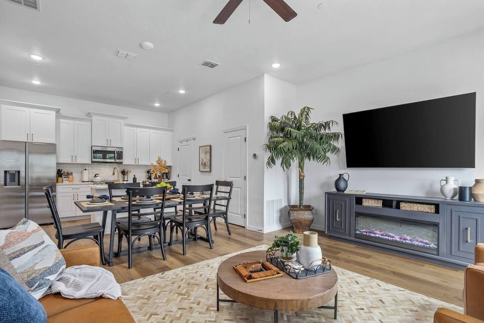 Unwind in a stylish living room with sleek furnishings and inviting seating, the perfect retreat after a day of excitement in Arlington's entertainment district.