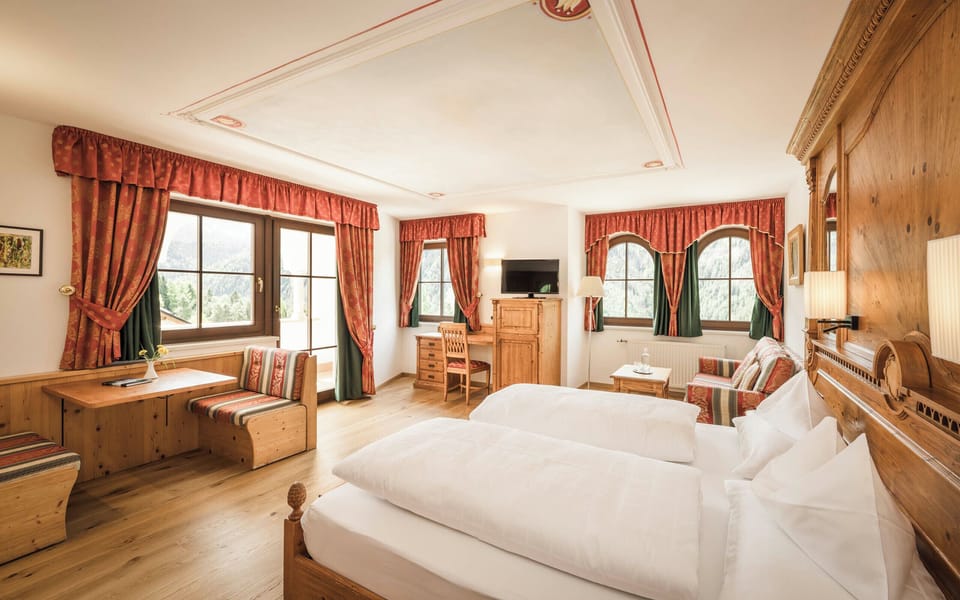 Superior room with balcony and Dolomite view | In-room safe, individually decorated, individually furnished, desk