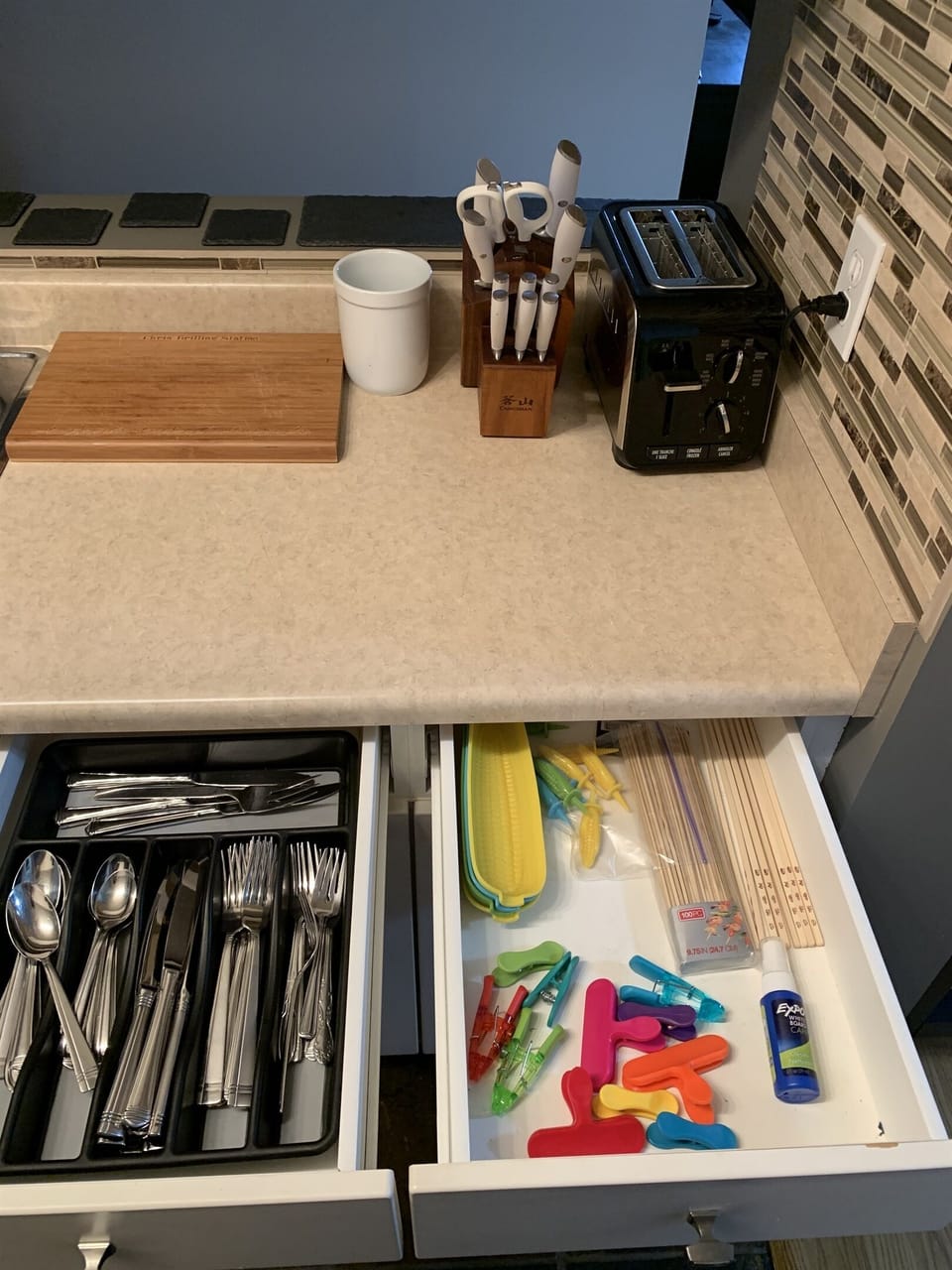 Cutlery, knives, toaster and more. Knifes are good quality and sharpening tool in knife block if needed.