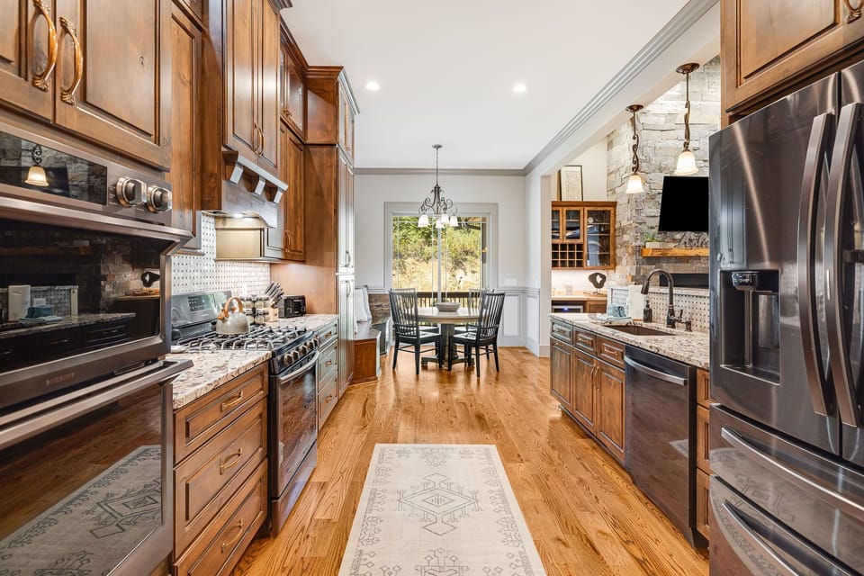 Chef's Gourmet Kitchen w/ Stainless Steel Appliances & Double Oven