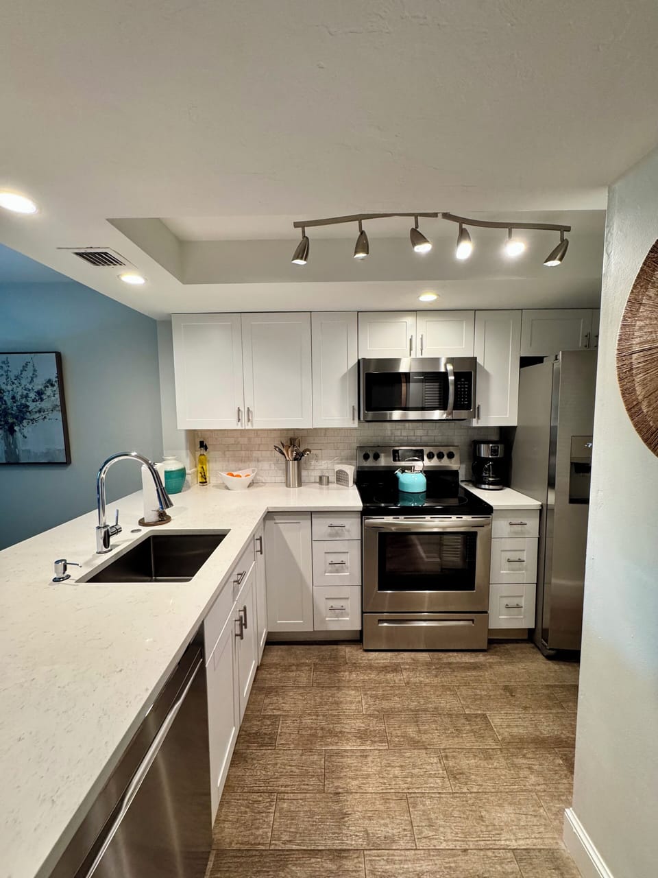 Full kitchen with dishes, utensils, toaster and coffee maker