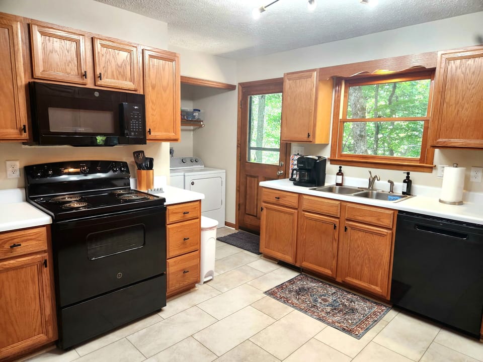 Electric stove, microwave, dishwasher, and Keurig Duo make life simple