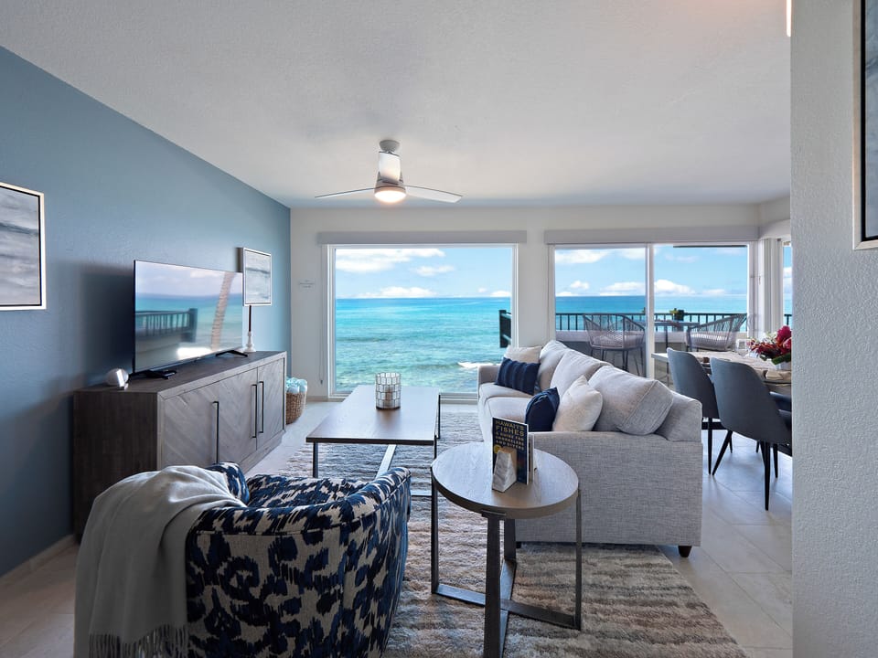 The open concept living area features a queen sofa-bed.