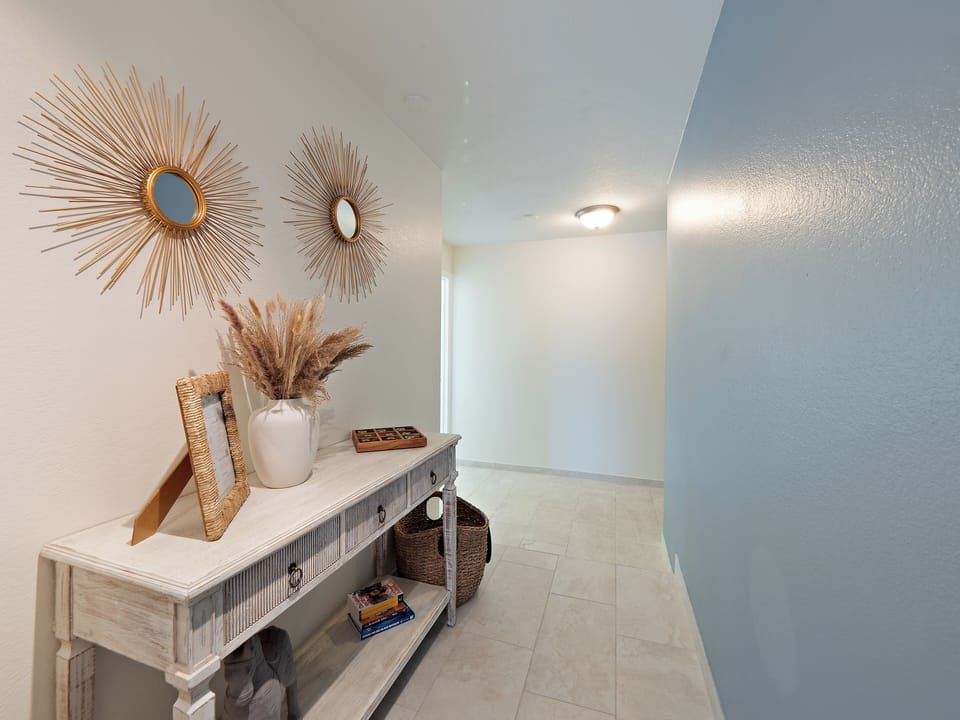 Warm natural light and stylish coastal décor set the tone for your serene stay.