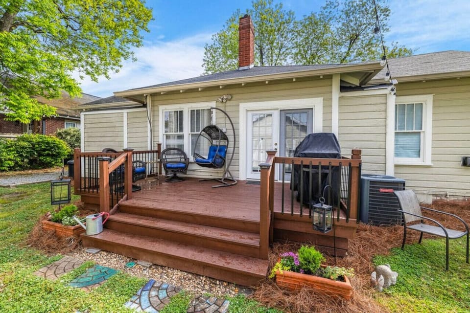 Enjoy peaceful mornings and cozy evenings on the back deck with a hammock chair and grill ready for your next cookout.
