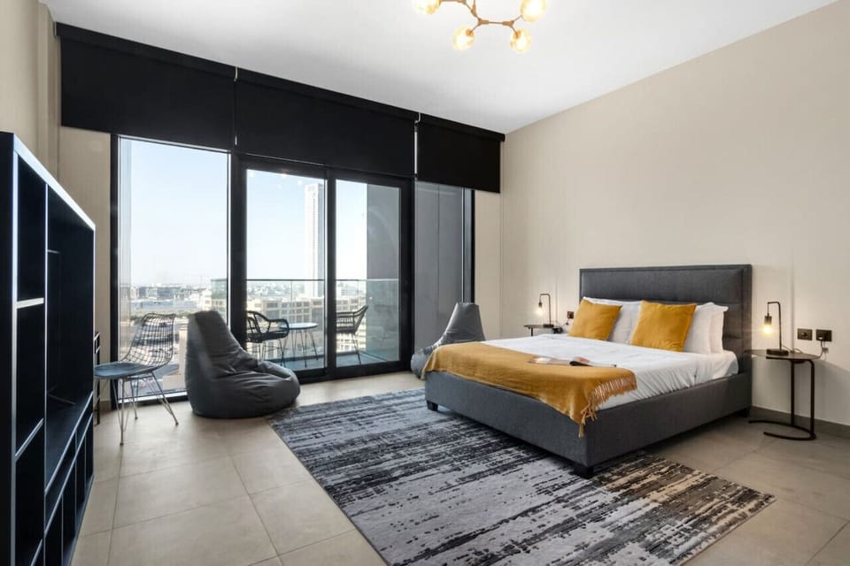 Spacious Bedroom Retreat: Enjoy stunning skyline views and stylish decor for your perfect getaway!