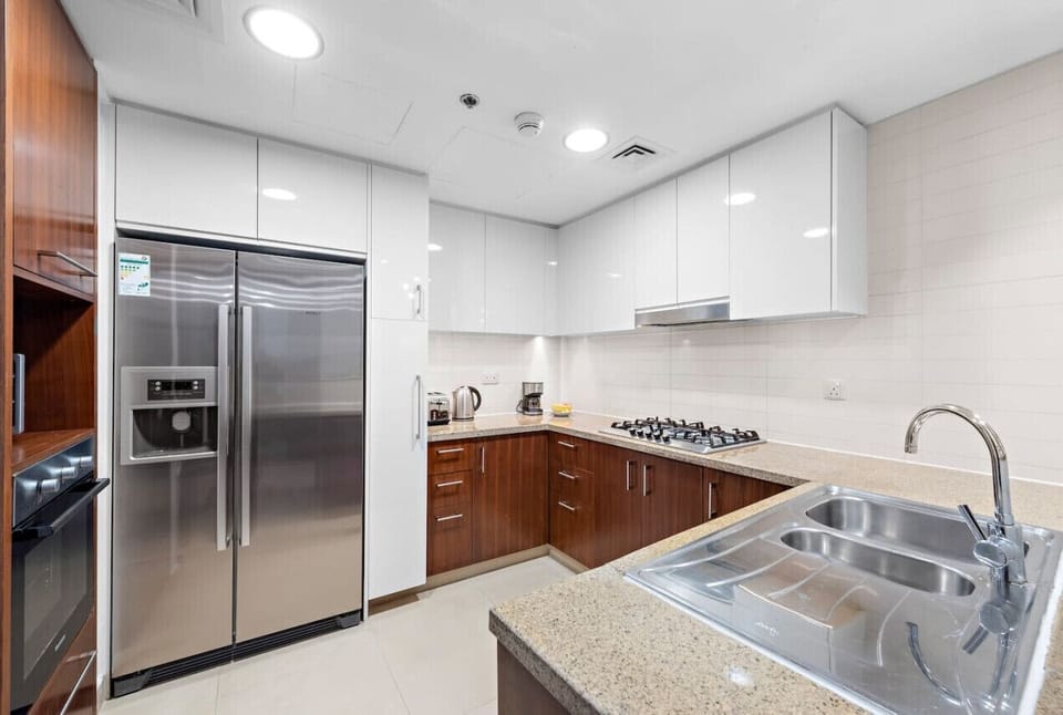 Modern Kitchen: Sleek appliances and stylish counters make cooking a delight in this culinary haven!