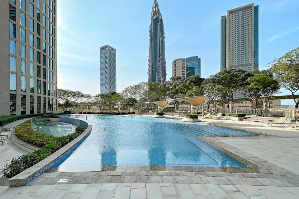 Pool Oasis: Dive into luxury with a shimmering pool and stunning skyline views!