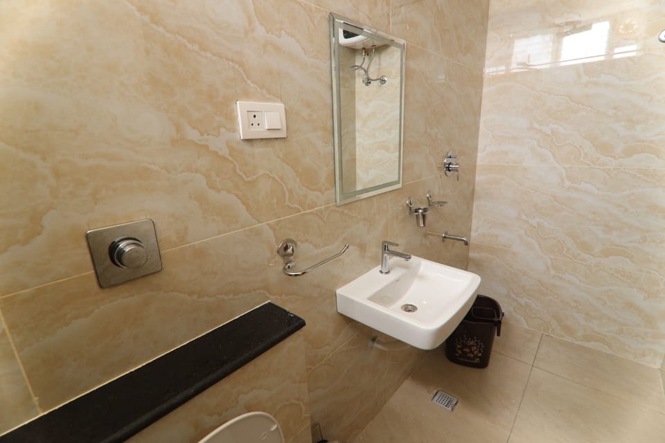 Shower, rainfall showerhead, hair dryer, towels