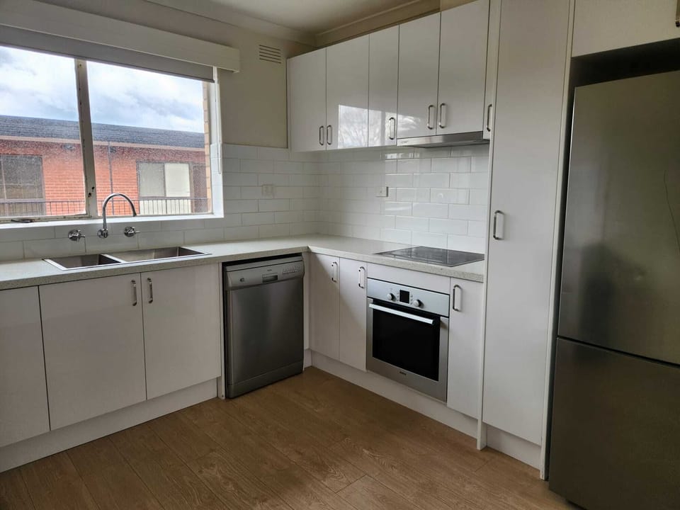 Full kitchen with fridge, freezer, dishwasher, oven, stove, cutlery, crockery
